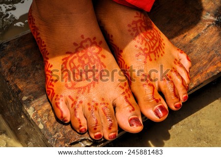 Traditional henna on brides feet on wedding in Bangladesh