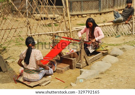 Nagaland, India - March 2012: Young women manufacturing textile in Nagaland, remote region of India. Documentary editorial.