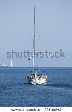 The yacht at the quiet blue sea