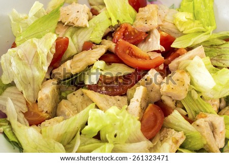Tomatoes, lettuce leaves, fried bird, olive oil
