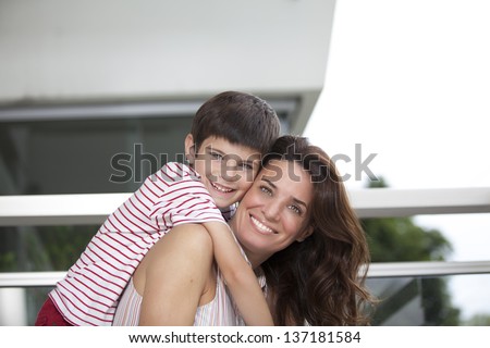 son climbed on the back of his mother
