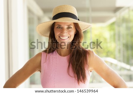 nice middle age lady with long hair and wearing a hat