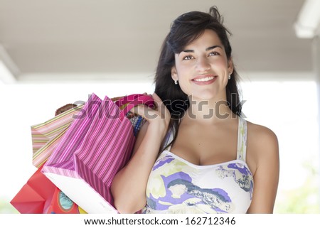lady smiling with bags in her hand