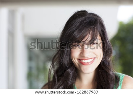 brunette lady with big smile