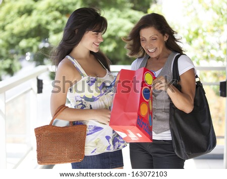 women with gifts and smiling