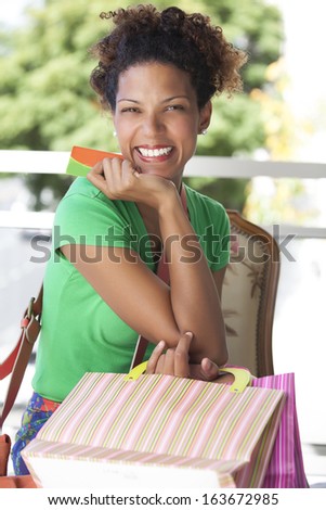 happy lady with credit card and bags