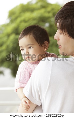 Oriental father caring for your baby