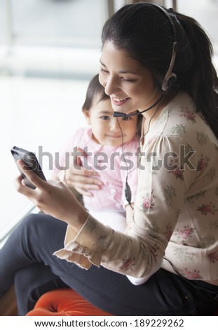 Smiling mother and baby in a video call