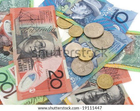 A pile of Australian banknotes and coins on white