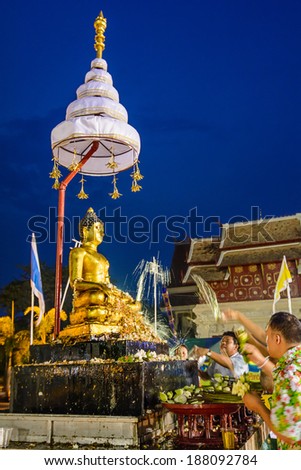 CHIANGMAI, THAILAND - APRIL 15: People pouring water to  Buddha Phra Singh at Phra Singh temple in Songkran festival on April 15, 2014 in Chiang Mai, Thailand.