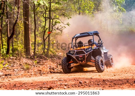 CHIANG MAI, THAILAND - MAY 03: Undefined Driver on Side-by-Side Vehicles (UTV) on countryside roads, May 03, 2015 in Chiang mai, Thailand.