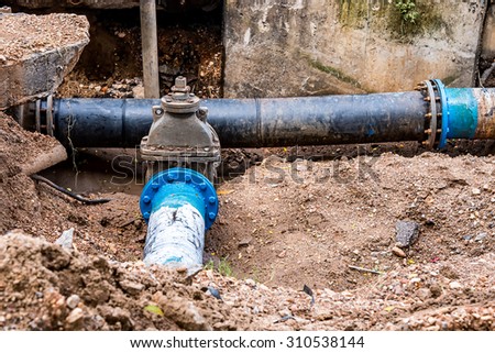 Water PVC Plastic Pipes in Ground during Plumbing Construction site.