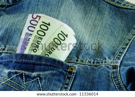 close up shot of denim jacket pocket with euros