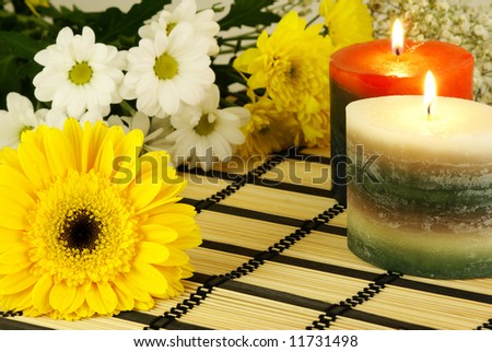 romantic relaxing scene with flowers and burning candles