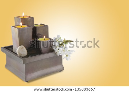 Candle holder and blossomed flower with lighted candles