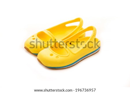 Children yellow shoes isolated on white background.