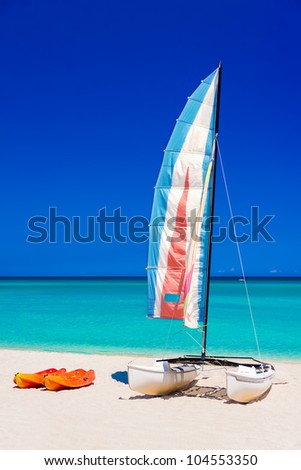 Colorful sailing boats on the  beach of Varadero in Cuba on a beautiful  summer day (vertical format without people)