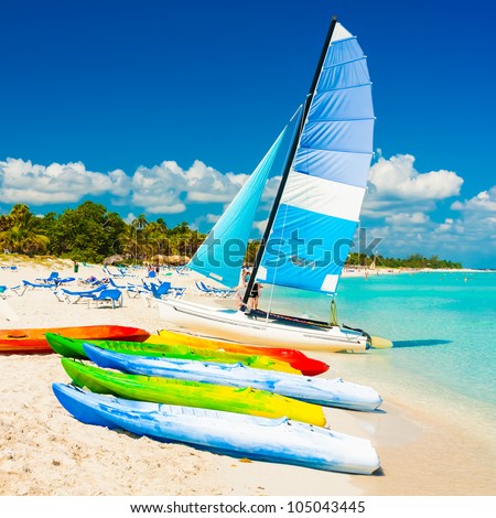 Colorful kayaks and sailing boats for rent at the beautiful beach of Varadero in Cuba