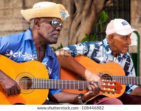 HAVANA-JULY 20:Unidentified musicians playing typical songs for tourists July 20,2012 in Havana.The cuban music and culture is an attraction for more than 2 million people who visit Cuba every year