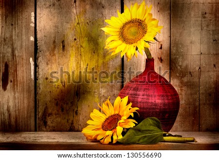 Beautiful sunflowers with and old weathered wood planks background