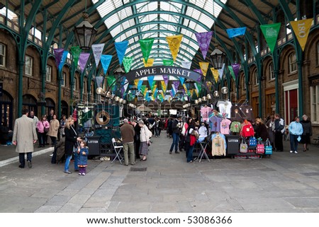 LONDON - MAY 13: Tourists visit the Covent Garden Market May 13, 2010 in London. One of the main London attractions, Covent Garden is visited by over 30 million people a year.