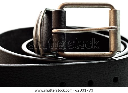 Close up view of a black leather belt on a white background