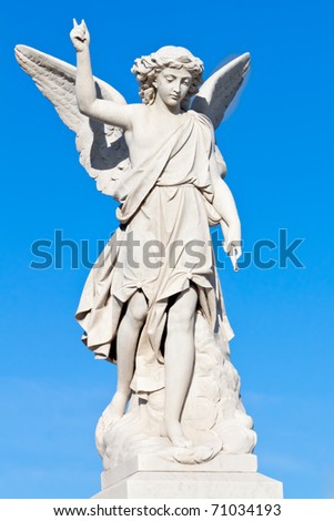 stock photo Beautiful young angel statue with a clear sky background