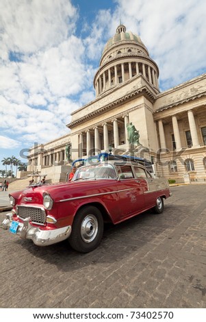 HAVANA-MAR 14:A classic car parks in front of the Capitol May 14,2011 in Havana.Cubans keep thousands of old cars running even when parts have not been produced for decades and they\'ve become iconic