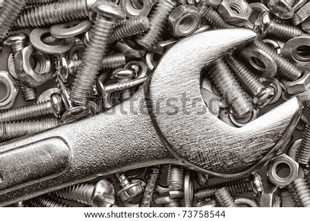 Macro shot of a spanner, nuts and bolts useful as a background