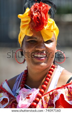HAVANA-MARCH 25:Young Woman with typical clothes and accessories March 25, 2011 in Havana.People dressed in a way that represents the cuban nationality can still be found in the streets of Old Havana