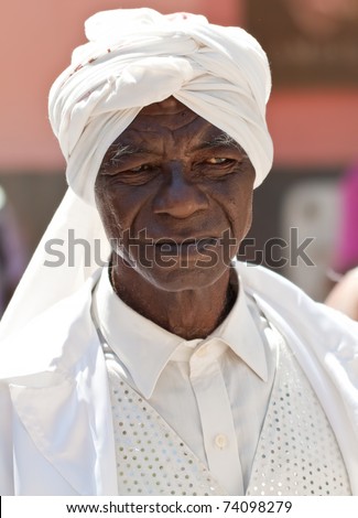 HAVANA-MARCH 25:Old black man with typical afrocuban clothes  March 25, 2011 in Havana.People dressed in a way that represents the cuban nationality can still be found in the streets of Old Havana