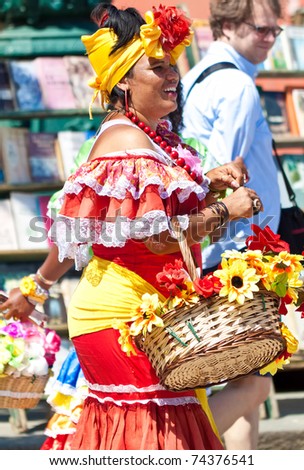 HAVANA-MARCH 25:Young Woman with typical clothes and accessories on March 25,2011 in Havana.People dress in a way that represents the cuban nationality can be found in the streets of Old Havana