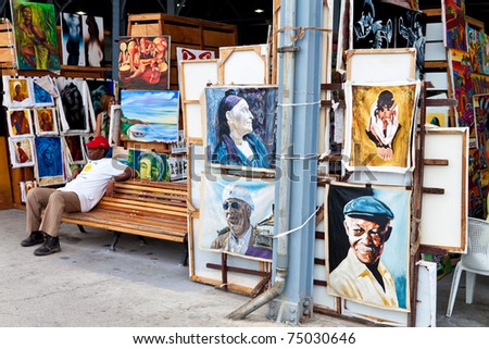 HAVANA-APRIL 2:Art market in Havana\'s old harbors April 2,2011 in Havana.One of Havana\'s tourist attractions,this fair sells paintings of iconic cuban themes and famous artistic or political figures
