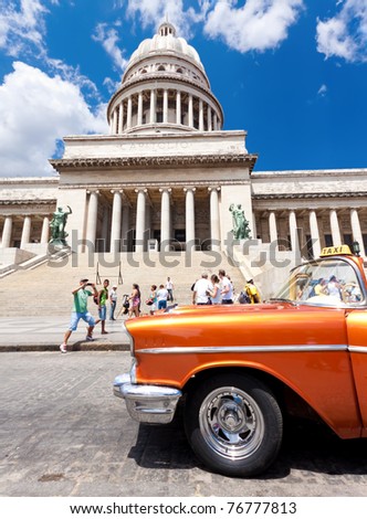 HAVANA-MAY 3:An Old Chevrolet sits in front of the capital building on May 3, 2011 in Havana, Cuba. Cubans keep thousands of classic cars like this running despite their age & lack of parts. They\'ve become an world known icon of the country.