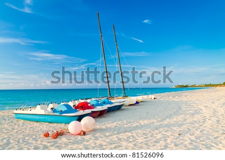 Sailing boats and water bikes in the beautiful cuban beach of Varadero