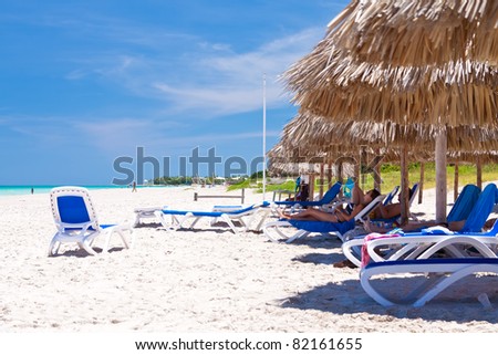 VARADERO,CUBA-JULY 16:Tourists sunbathing at the beach July 16,2011 in Varadero.With over 1 million visitors a year,Varadero is the main destination for the growing cuban tourist industry