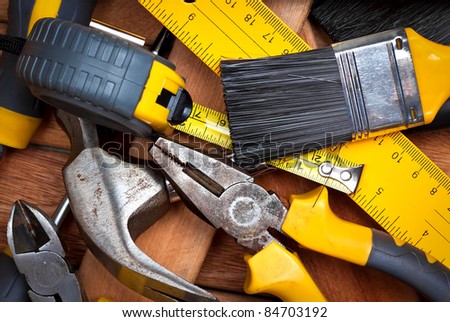 Set of manual  tools on a wooden boards background