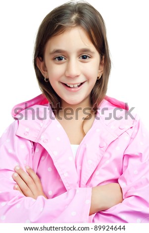 Portrait of a beautiful latin girl wearing a pink raincoat isolated on white