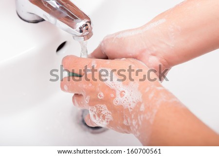 Washing hands in the bathroom. Cleaning hands.Hygiene