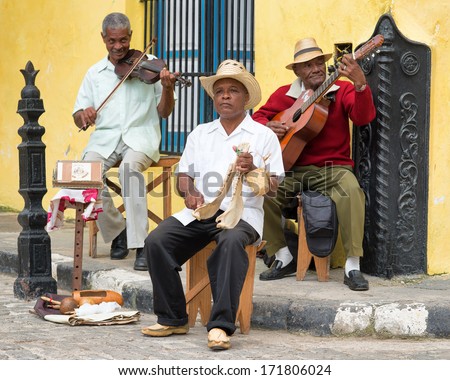 Havana,Cuba - January 15, 2014:Afrocuban Street Musicians Playing Traditional Music.2 850 000 Foreign Tourists Visited Cuba In 2013,Many Of Them Attracted By Its Distinct Culture