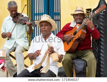 HAVANA,CUBA - JANUARY 15, 2014:Afrocuban street musicians playing traditional music.2 850 000 foreign tourists visited Cuba in 2013,many of them attracted by its distinct culture