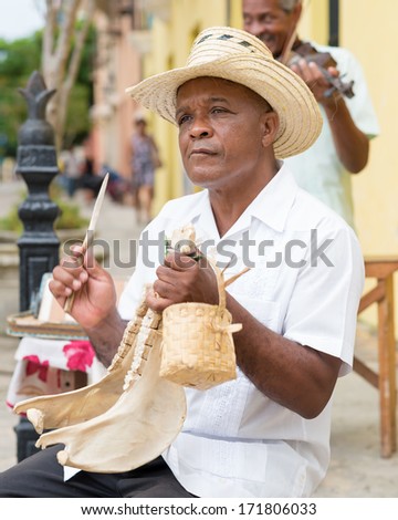 HAVANA,CUBA - JANUARY 15, 2014:Street performers playing traditional music.2 850 000 foreign tourists visited Cuba in 2013,many of them attracted by its distinct culture