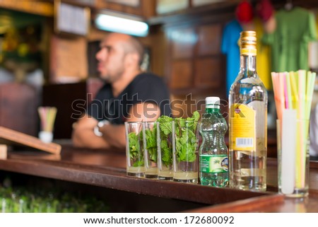 HAVANA,CUBA - JANUARY 20, 2014:Mojitos,a well known cuban cocktail being prepared at La Bodeguita del Medio.This world famous restaurant was a favorite of celebrities such as Ernest Hemingway
