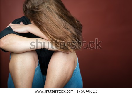 Sad and lonely young woman crying (with space for text)