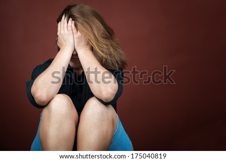 Sad and lonely young woman crying (with space for text)