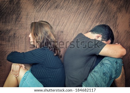 Divorce,fight,probl ems - Young couple angry at each other sitting back to back