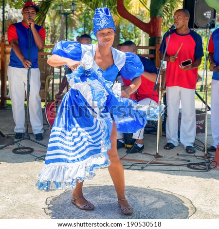 VARADERO,CUBA - APRIL 26,2014 : Afrocuban dancer and traditional music band playing for tourists at a seaside resort