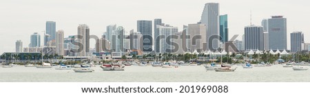 MIAMI,USA - MAY 27,2014 : Panoramic view of downtown Miami with yachts and fishing boats on the foreground