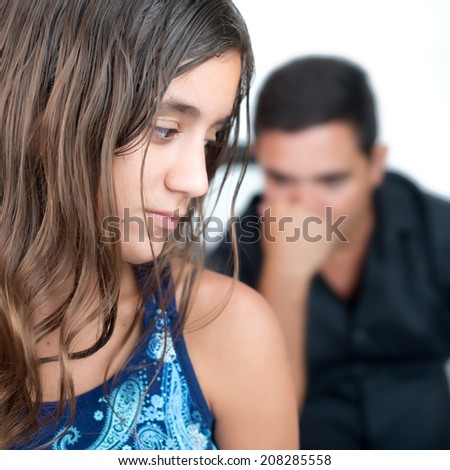 Teenage problems, teenage girl and her worried father at home
