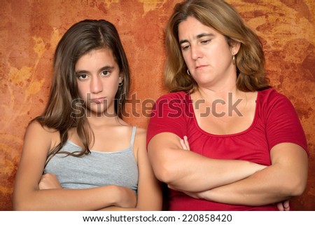 Teenager problems - Angry teenage girl and her sad and worried mother